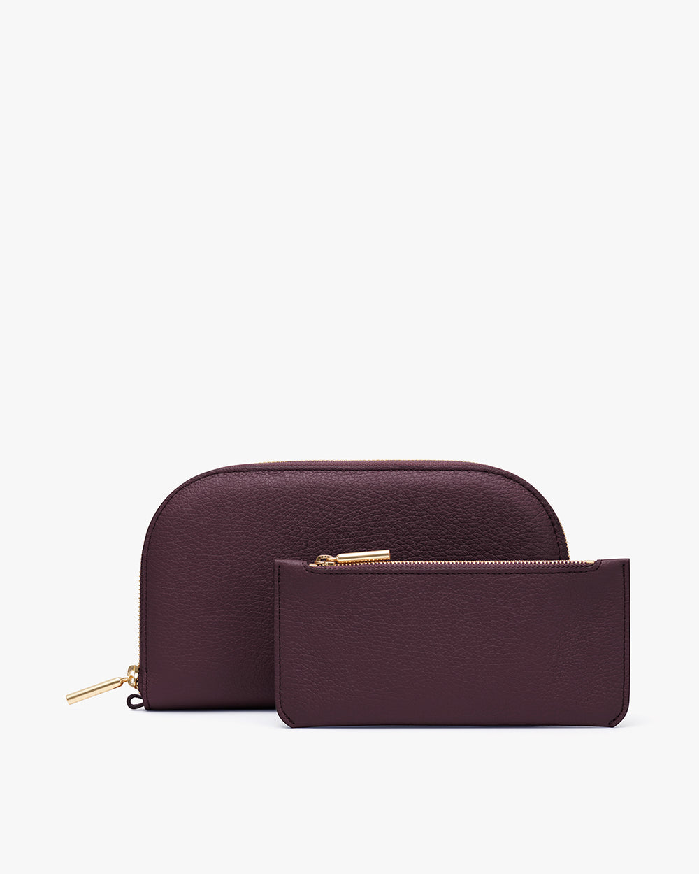 Two leather wallets with zippers, one larger and one smaller.