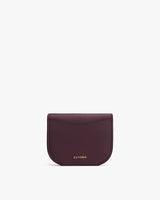 Small folded cardholder with brand logo at the bottom center