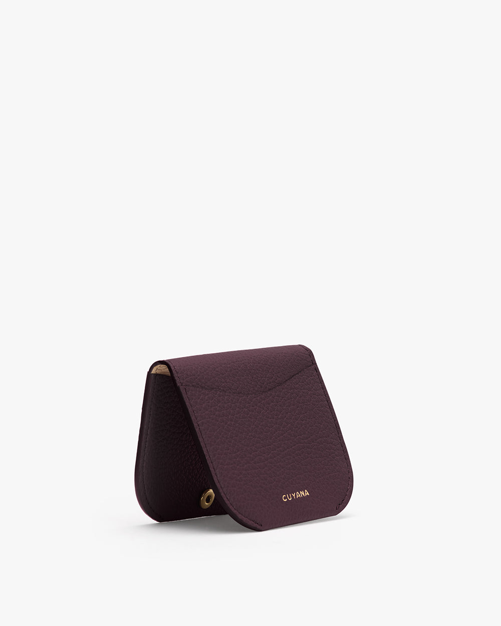 Small, folded cardholder with subtle gold text on the front.