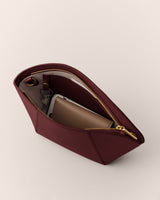 Open pouch with visible contents and a zippered opening