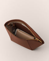 Open pouch with phone and small wallet inside