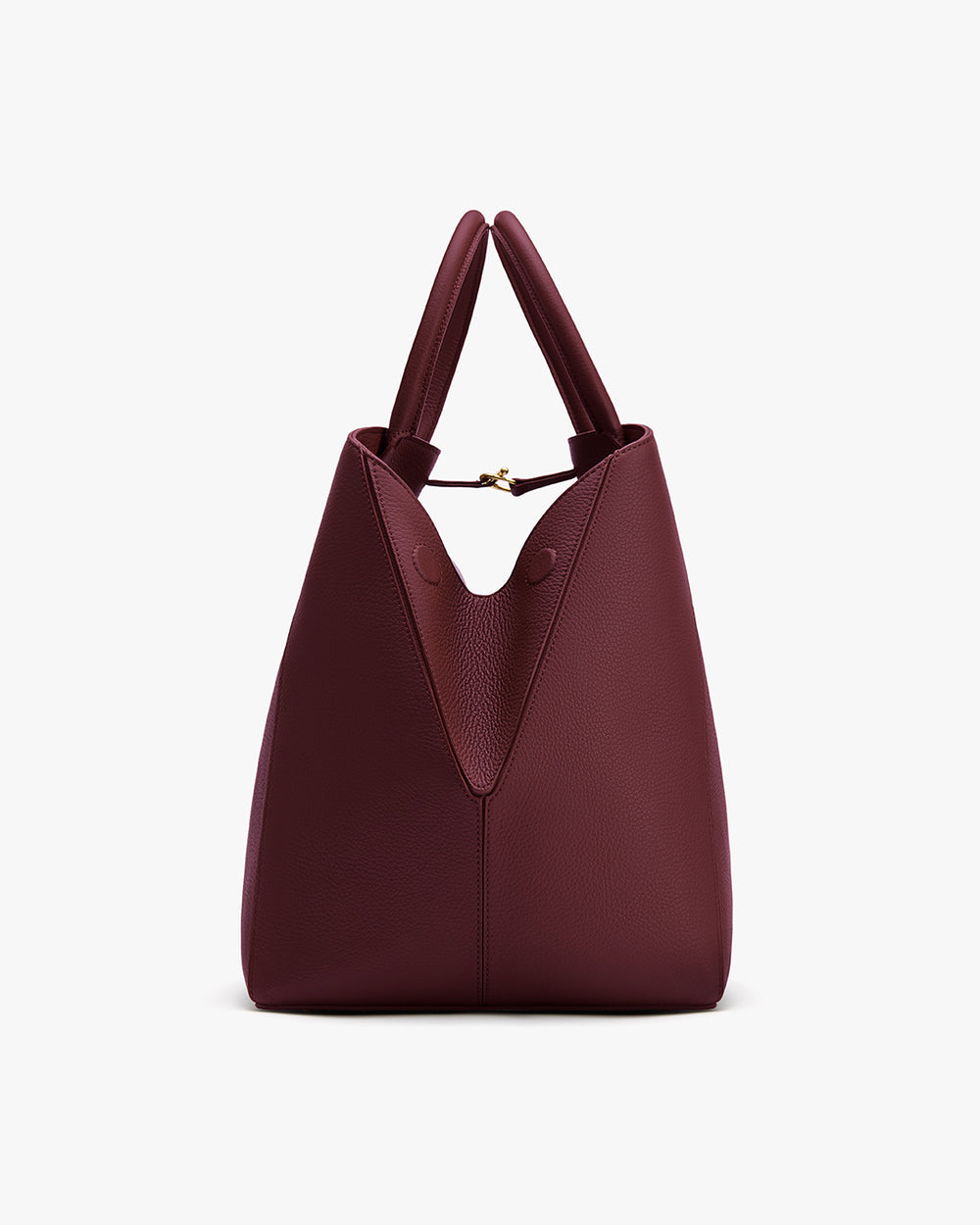 A handbag with two handles and a unique closure design.