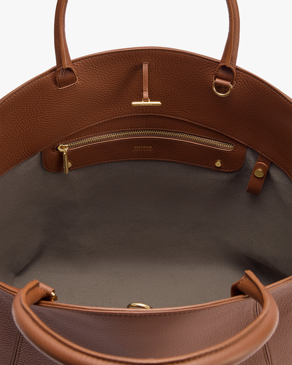 Open handbag showing inside pocket and zipper