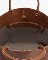 Open handbag showing inside pocket and zipper