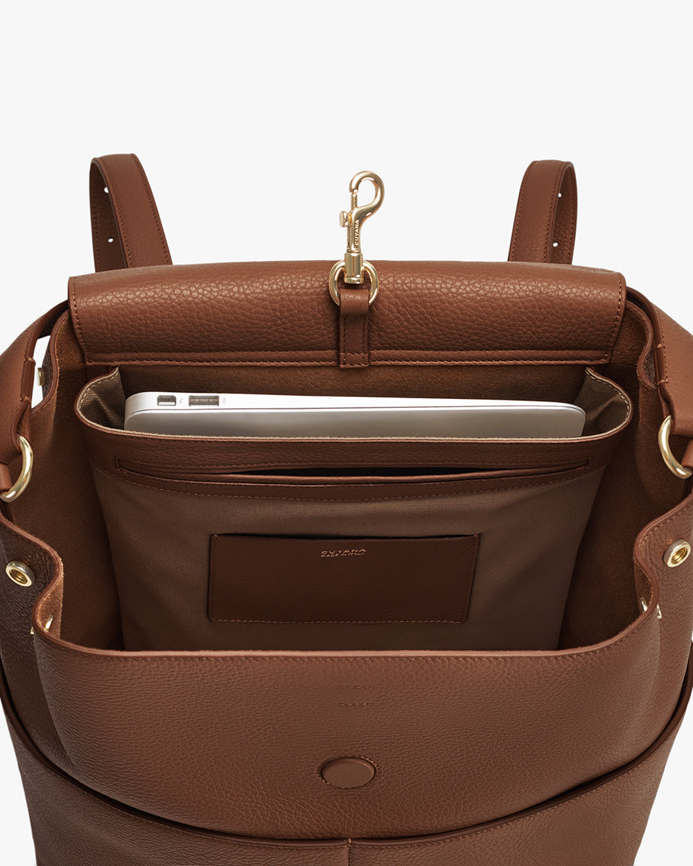 Open backpack with laptop inside and clasp on top
