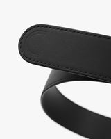 Close-up view of a belt with a stitched loop.