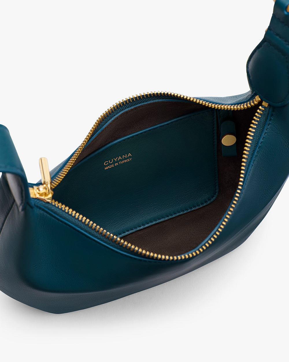 Open handbag with visible interior pocket and zipper closure