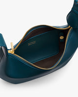 Open handbag with visible interior pocket and zipper closure