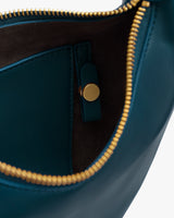 Open handbag with visible zipper and pocket inside.