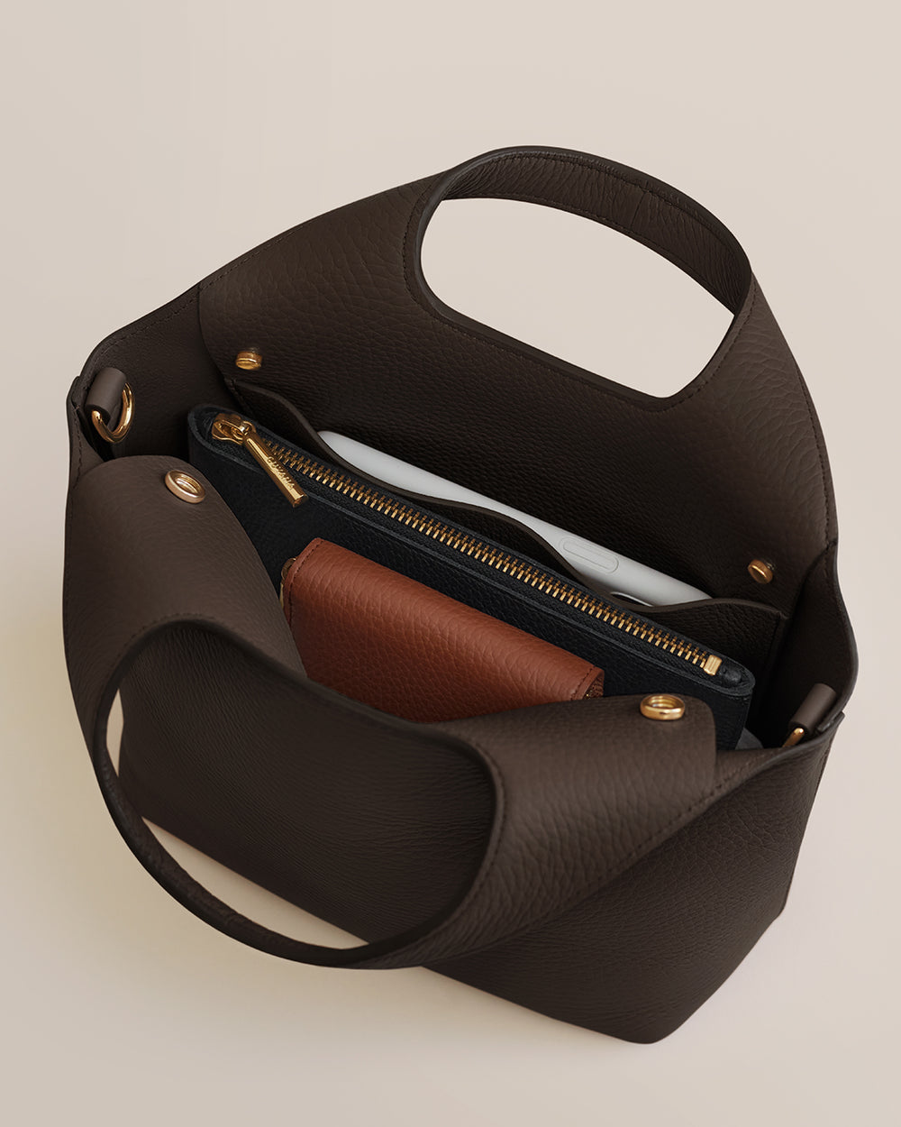 Open handbag with a wallet and zippered pouch inside