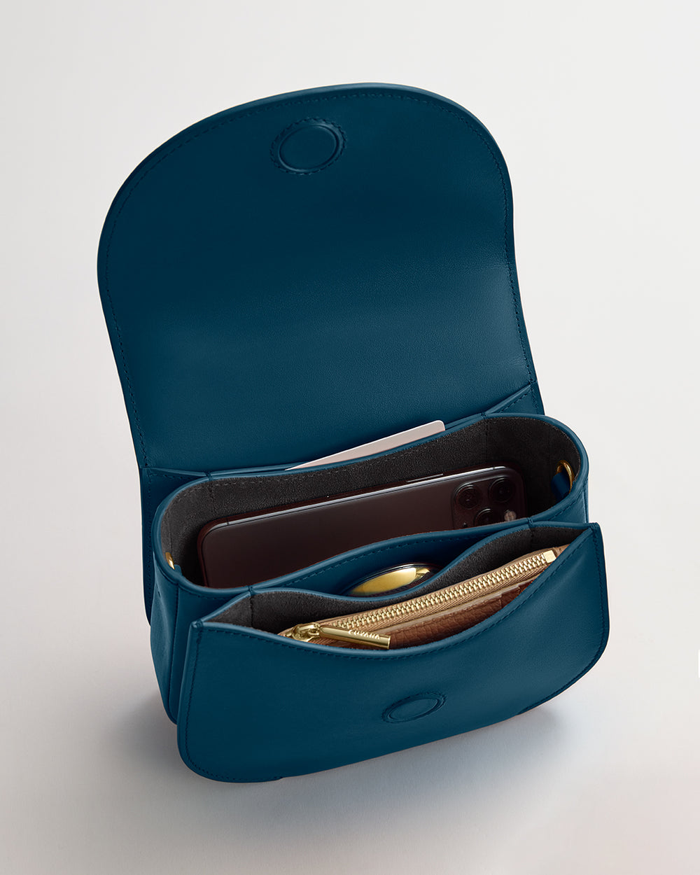 Open purse with phone and wallet inside