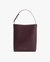 Leather shoulder bag with a simple design and a single strap.