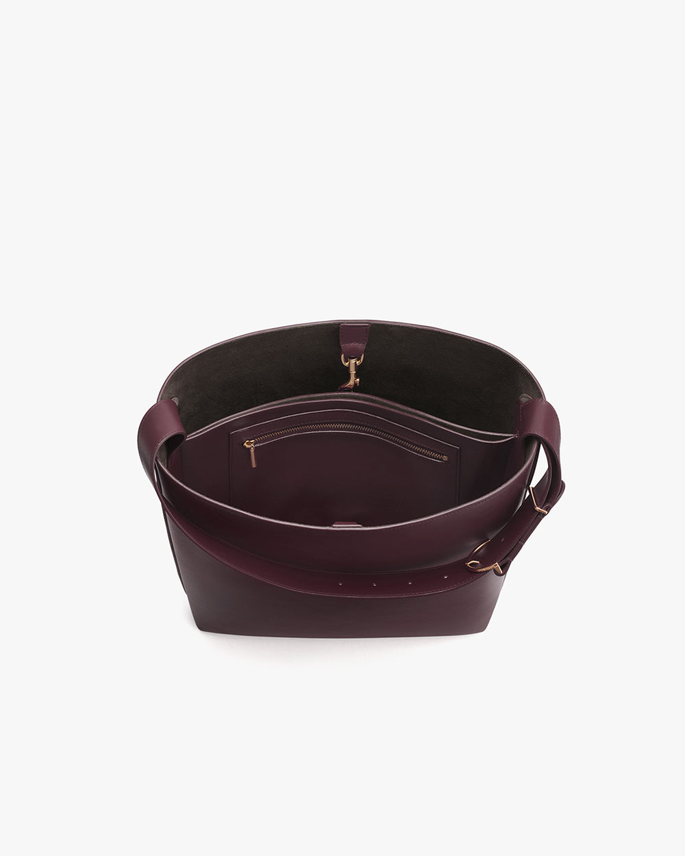 Open handbag with visible interior pockets and strap.