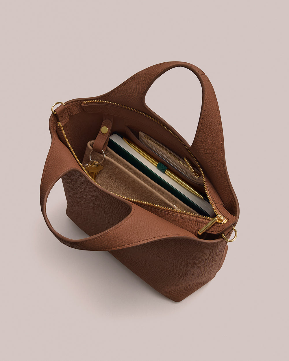 Open handbag with books and items inside