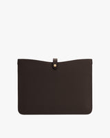 Leather laptop sleeve with a button closure at the top center.