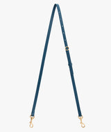 Long adjustable strap with clasps on each end shown on a plain background