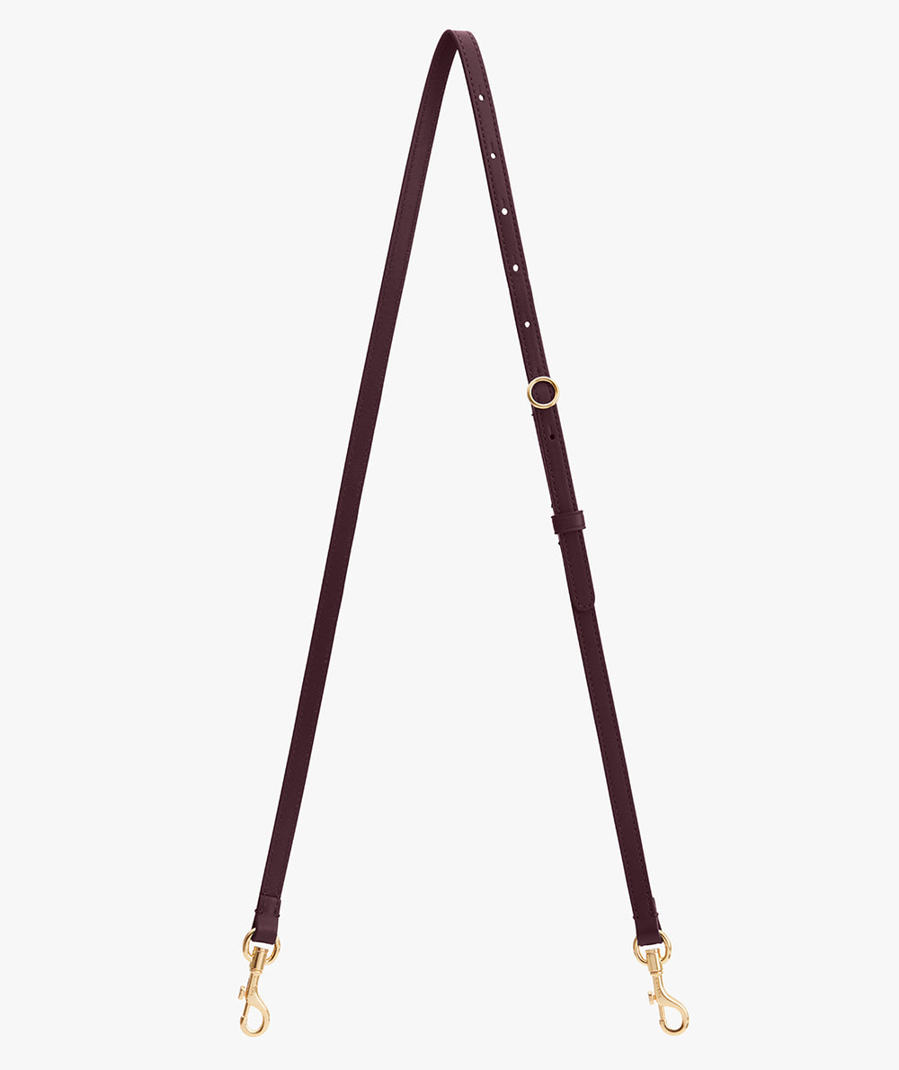 Adjustable bag strap with metal clasps on each end.