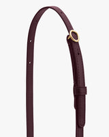 Thin adjustable leather strap with a small metal buckle on it