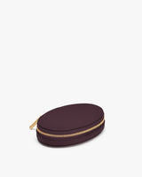 Oval zippered case on white background
