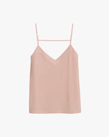 Tank top with thin straps and a V-neckline, hanging on a hanger.