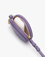 Small purse with zipper and attached strap.