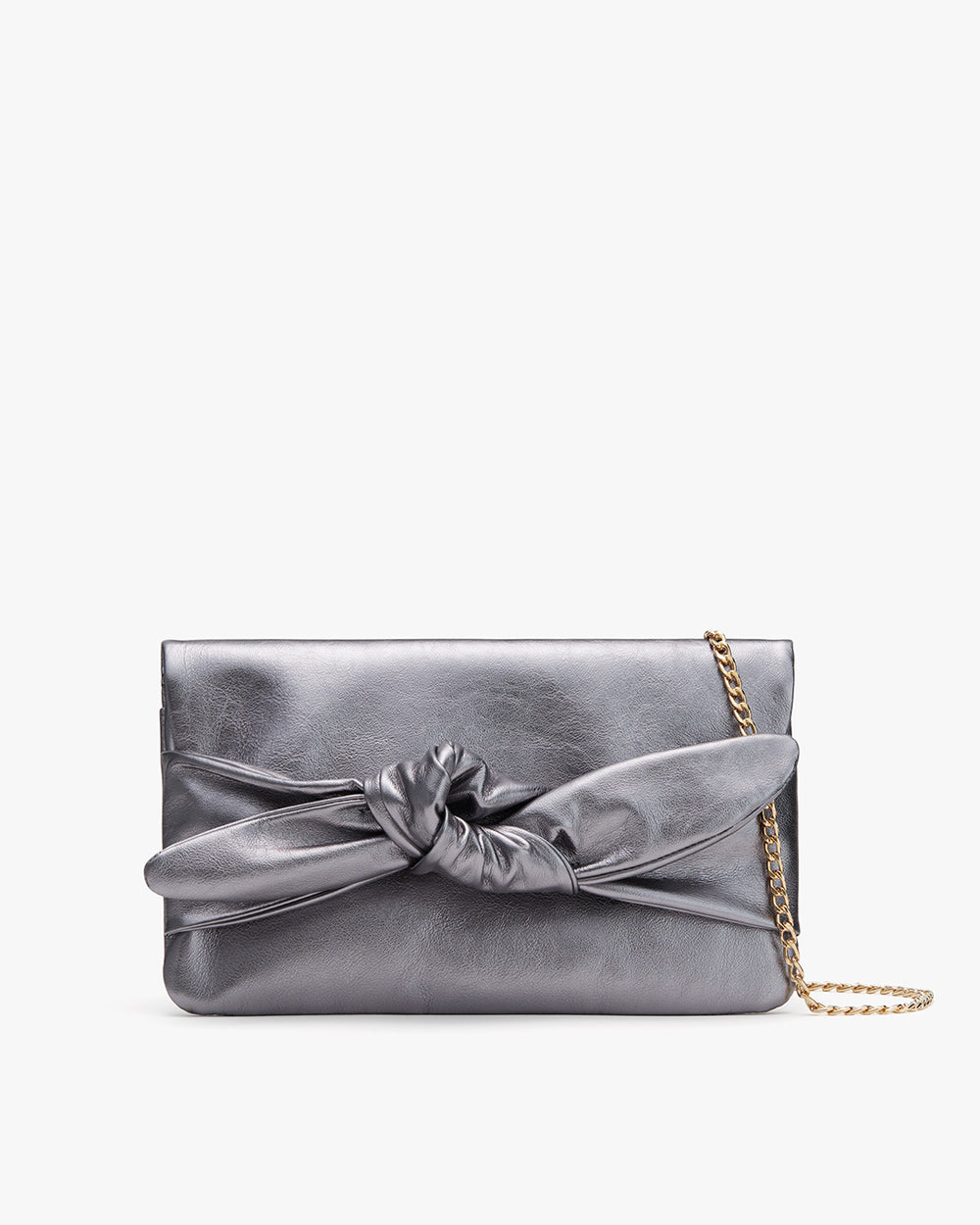 Purse with a bow and chain strap against a plain background.