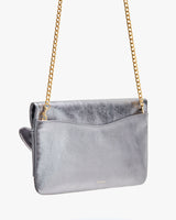 Shoulder bag with chain strap and fold-over flap.