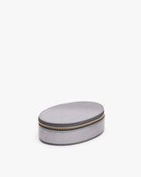 Round zippered case on a plain background.