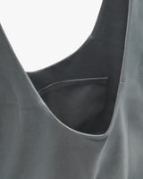 Close-up of a pocket on a sleeveless top.