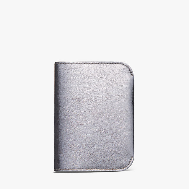 Leather wallet on a plain background.
