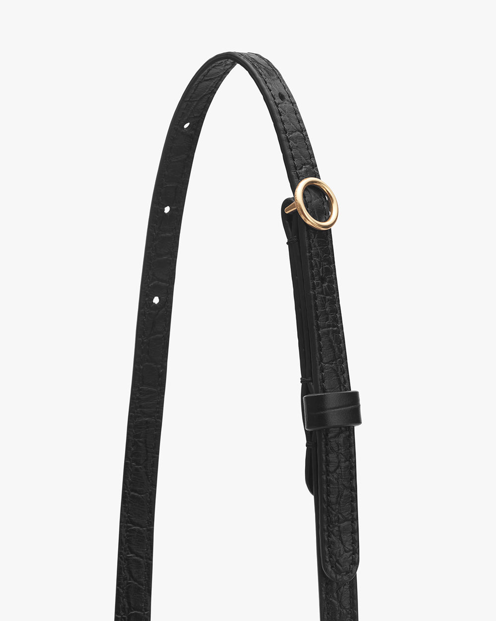 Leather belt with a circular buckle and loop.