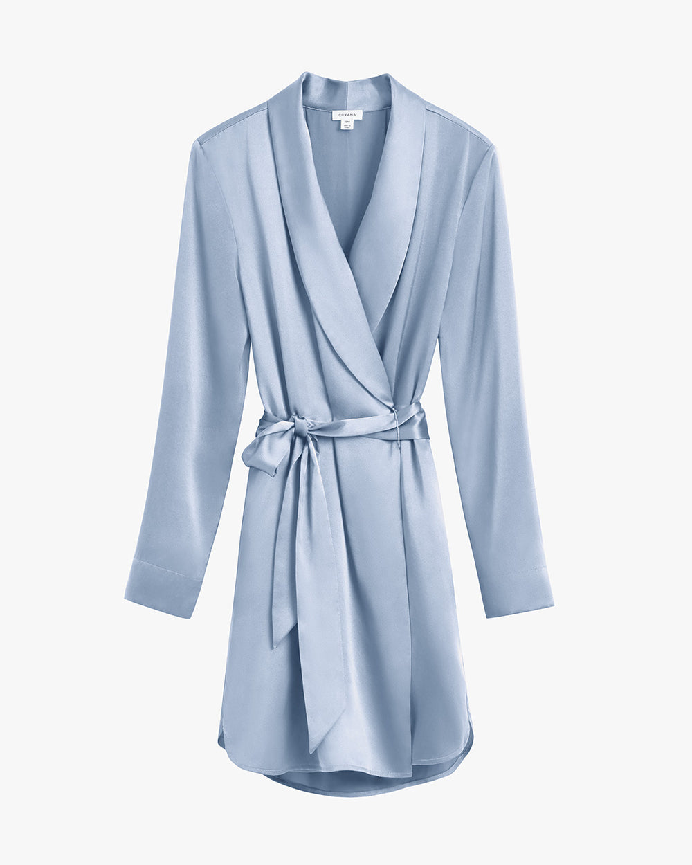 Bathrobe with a belt, hanging against a plain background.