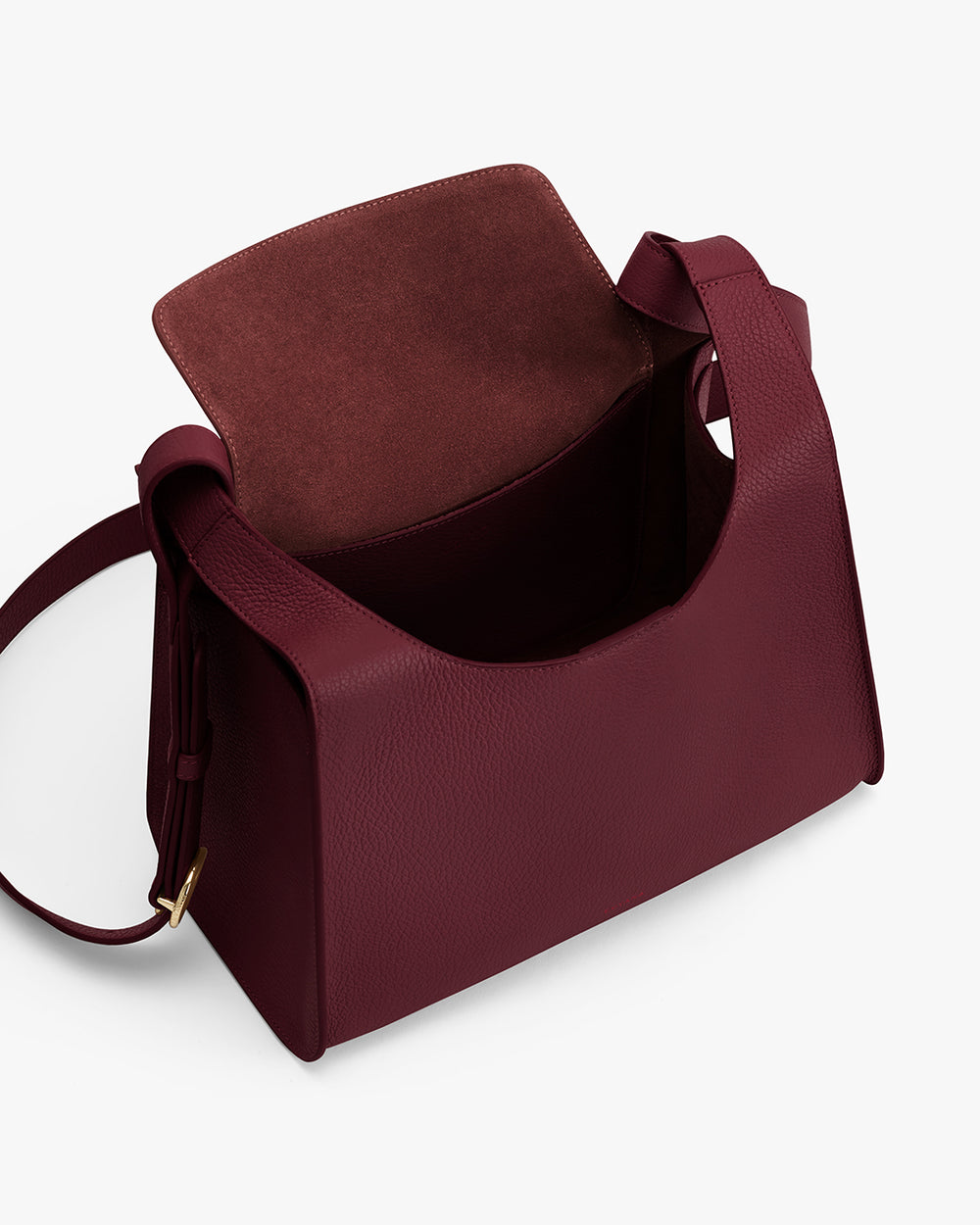 Open shoulder bag with wide strap and visible inner lining.