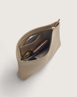 Open pouch with a zipper showing cosmetics and accessories.