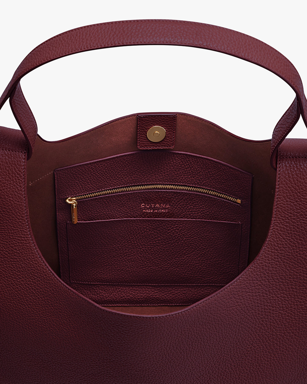 Open tote bag showing interior pocket with zipper and clasp.