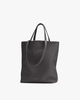 Tote bag with two handles on a plain background.