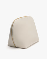 Rounded zippered pouch with minimal design.