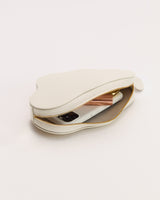 Cloud-shaped pouch with a zip, partially open showing items inside.