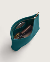 Open pouch with zipper containing cosmetic items.