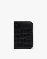 Wallet with textured exterior standing against a plain background.
