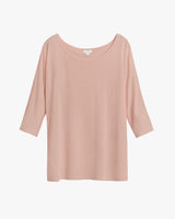 Plain blouse with three-quarter sleeves and a round neckline.