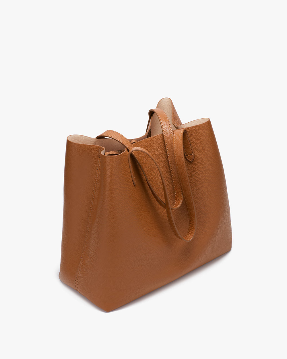 Handbag standing upright on a plain background