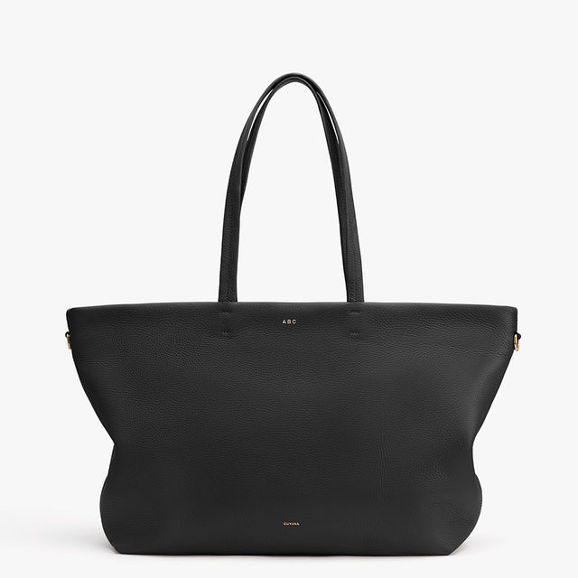 Large handbag with two handles and a logo near the top front.