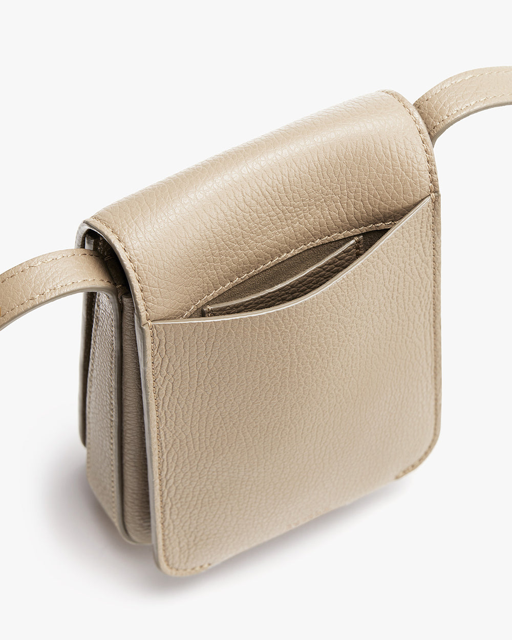 Small handbag with a top handle and visible pocket