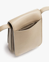 Small handbag with a top handle and visible pocket