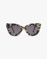 Cat-eye sunglasses with patterned frames and dark lenses.