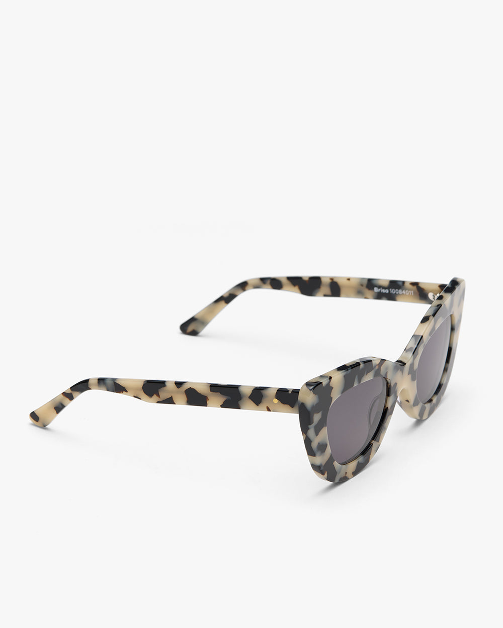 Cat-eye sunglasses with patterned frame and dark lenses.