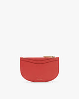 Small half-moon shaped wallet with zipper at top edge.