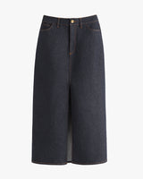 Long denim skirt with front slit and button closure.