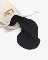 Drawstring bag with flap partially open